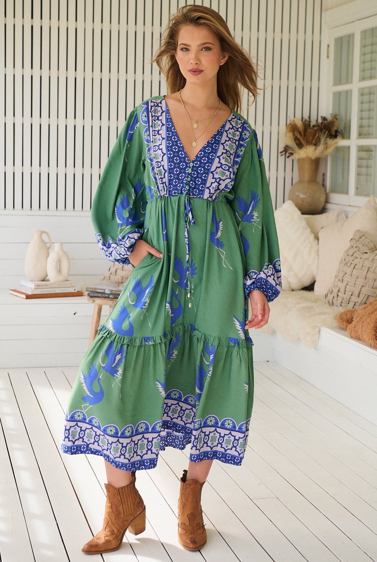 Model wearing Bluebird Willa Boho Midi Dress by Jaase - floral print, long sleeves, 100% rayon, relaxed fit.