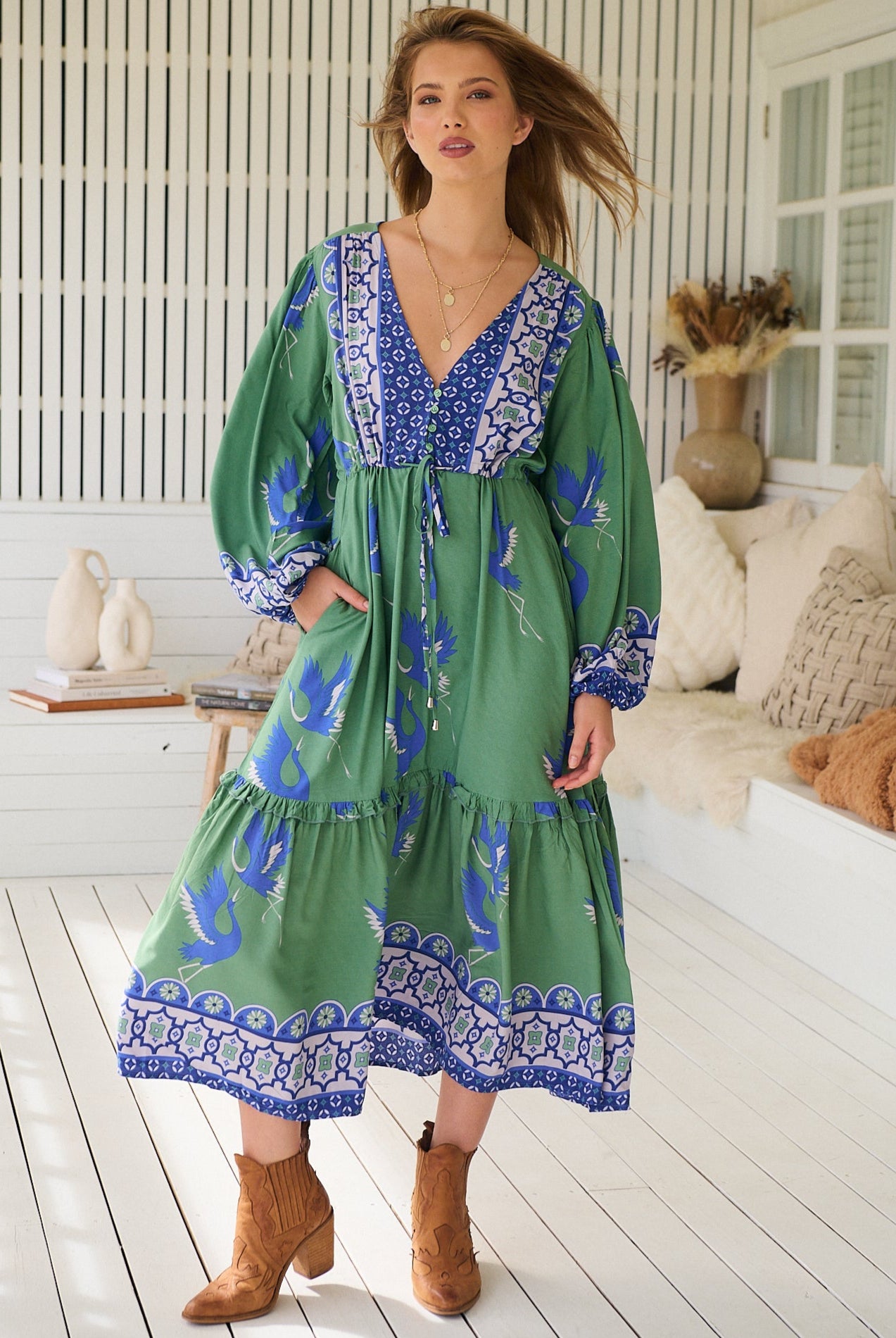 Model wearing Bluebird Willa Boho Midi Dress by Jaase - floral print, long sleeves, 100% rayon, relaxed fit.