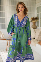 Model wearing Bluebird Willa Boho Midi Dress by Jaase - floral print, long sleeves, 100% rayon, relaxed fit.