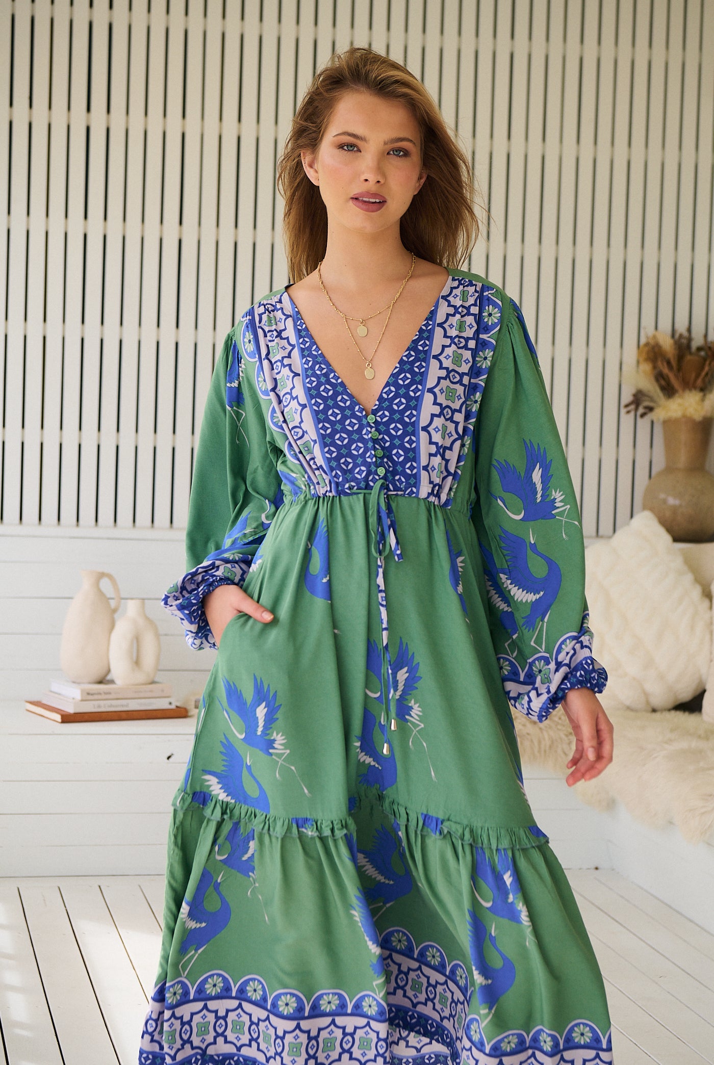 Model wearing Bluebird Willa Boho Midi Dress by Jaase - floral print, long sleeves, 100% rayon, relaxed fit.