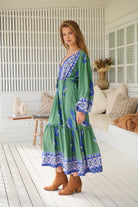 Model wearing Bluebird Willa Boho Midi Dress by Jaase - floral print, long sleeves, 100% rayon, drawstring waist.