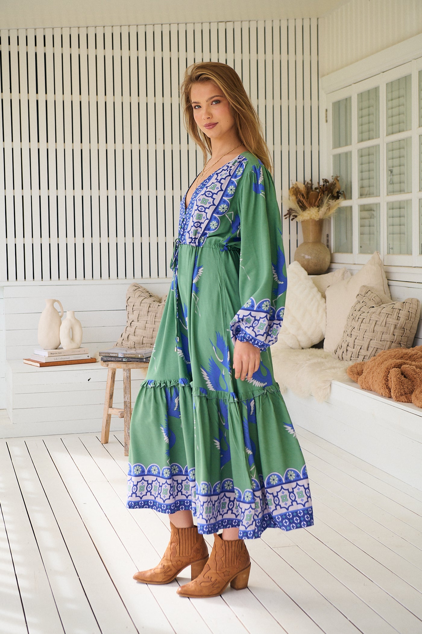 Model wearing Bluebird Willa Boho Midi Dress by Jaase - floral print, long sleeves, 100% rayon, drawstring waist.