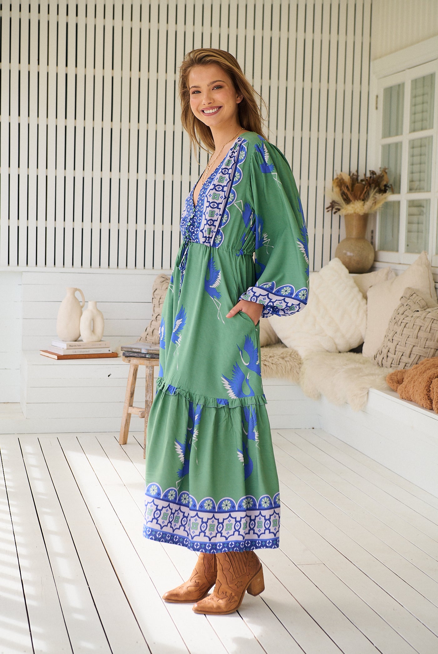 Model wearing Bluebird Willa Boho Midi Dress by Jaase - floral print, long sleeves, 100% rayon, drawstring waist.