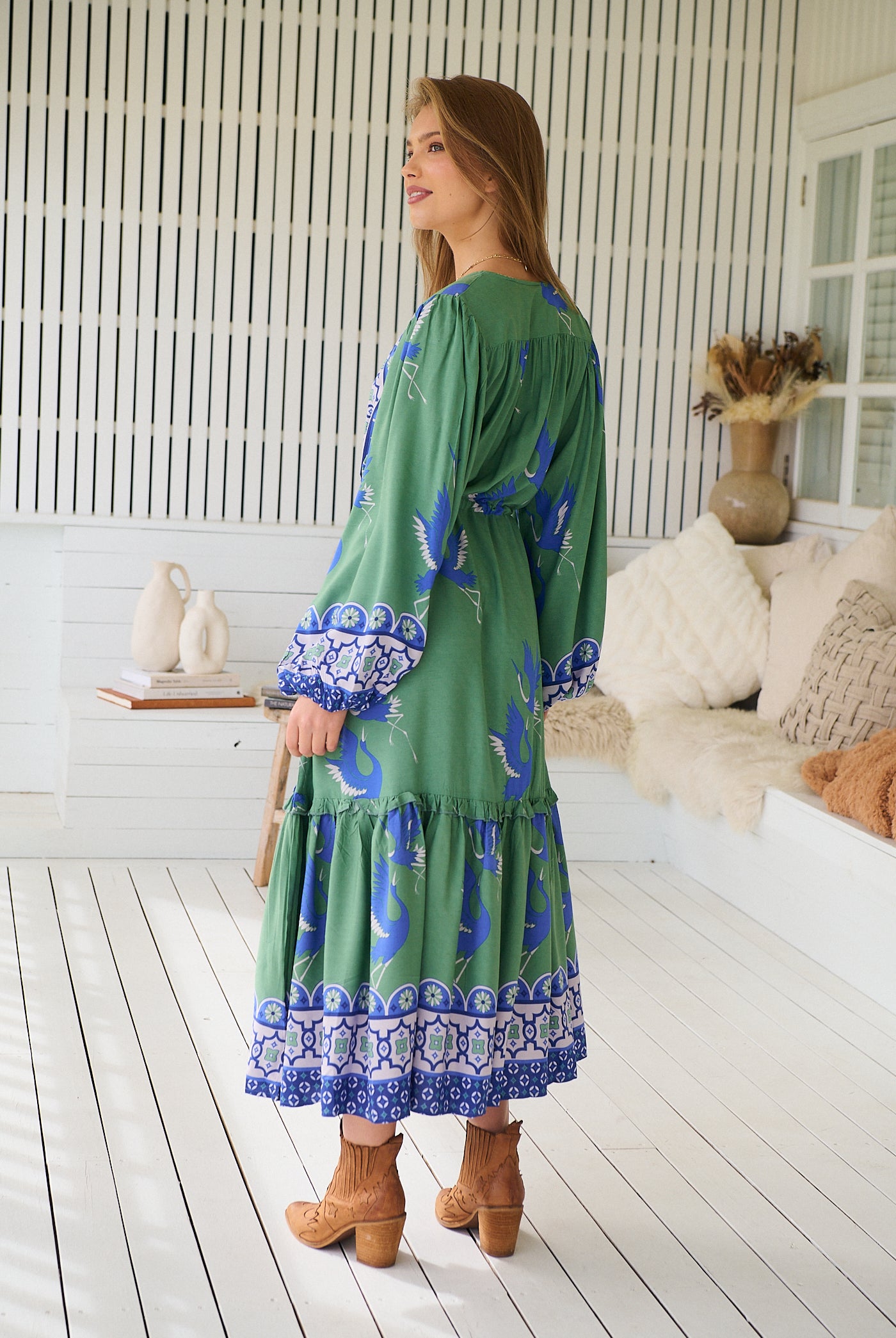 Model wearing Bluebird Willa Boho Midi Dress by Jaase - floral print, long sleeves, 100% rayon, drawstring waist.