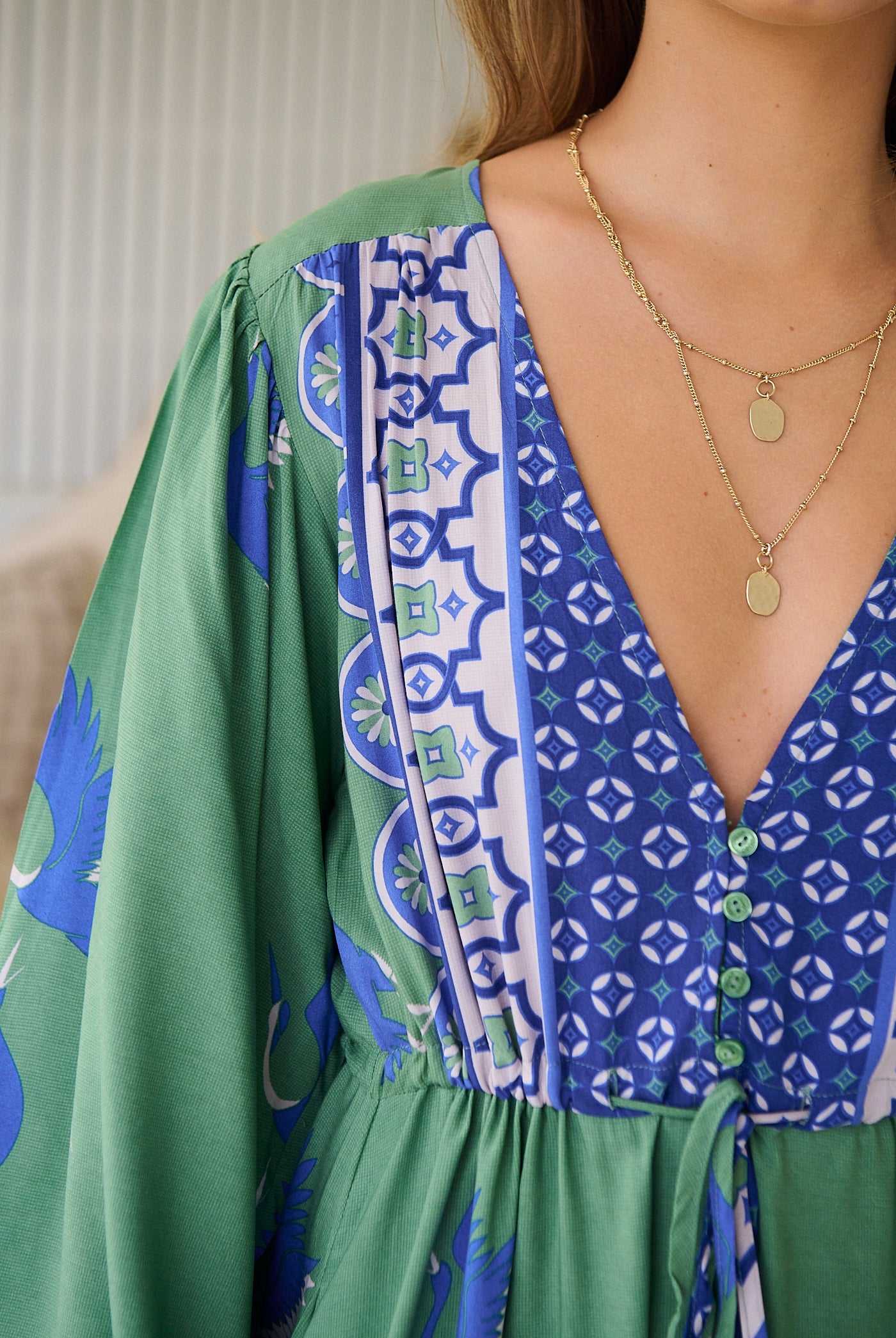 Model wearing Bluebird Willa Boho Midi Dress by Jaase - floral print, long sleeves, 100% rayon, relaxed fit.