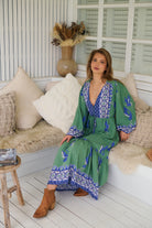 Model wearing Bluebird Willa Boho Midi Dress by Jaase - floral print, long sleeves, 100% rayon, relaxed fit.