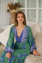 Model wearing Bluebird Willa Boho Midi Dress by Jaase - floral print, long sleeves, 100% rayon, relaxed fit.