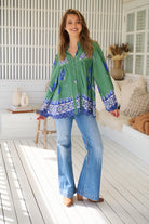 Model wears rayon Boho blouse with vintage print - feminine & effortless