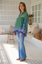 Model wears rayon Boho blouse with vintage print - feminine & effortless