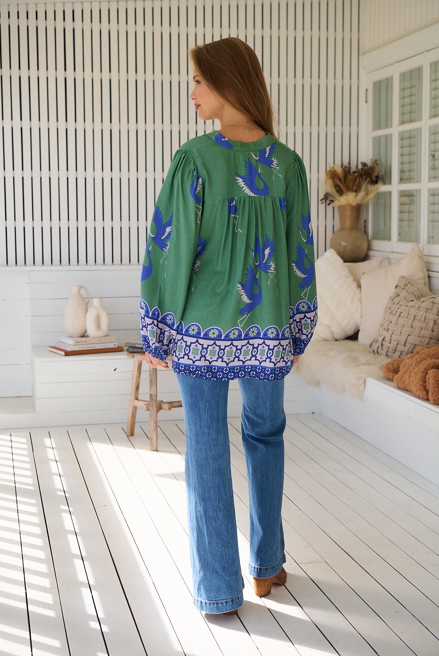 Model wears rayon Boho blouse with vintage print - feminine & effortless