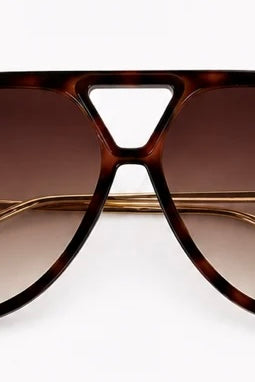 Woman wearing Jacqueline oversized aviator sunglasses in brown tortoiseshell with gradient lenses