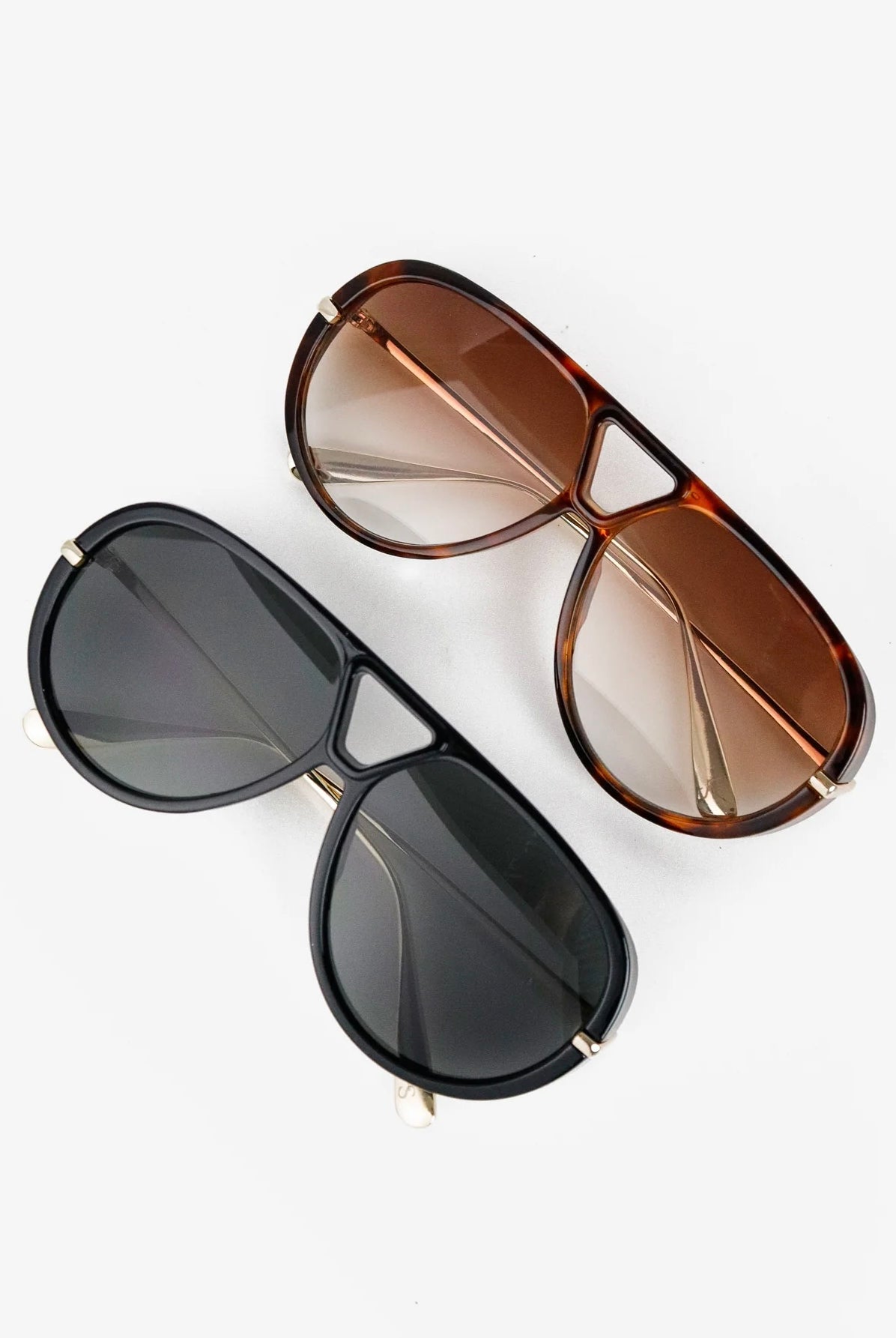 Woman wearing Jacqueline oversized aviator sunglasses in brown tortoiseshell with gradient lenses
