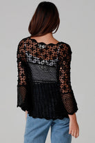 woman wearing black cotton crochet top with scalloped sleeves and flared hem - Boho crochet blouse Australia.