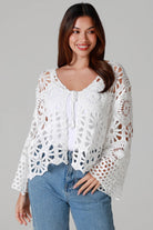 White crochet cardigan with tie front and boho bell sleeves layered over denim - crochet cardigan Australia.