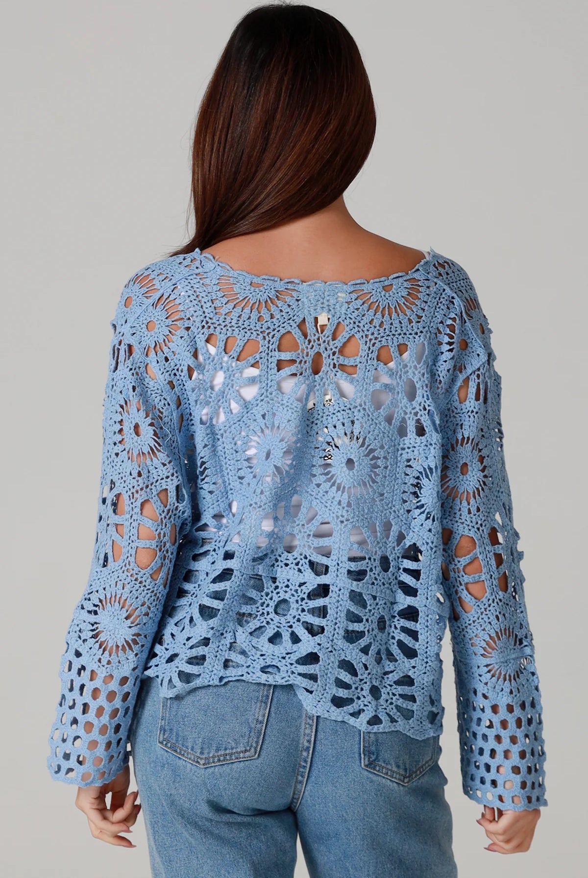 Pale blue cotton crochet boho cardigan with bell sleeves and tie front styled with denim - bohemian coastal fashion.
