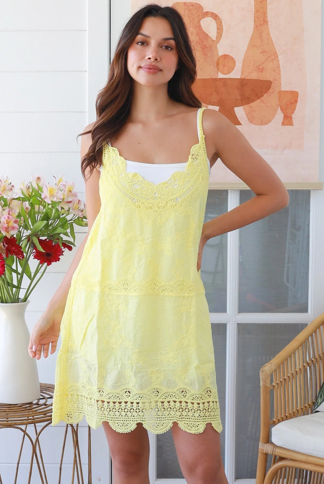 Woman in lemon yellow embroidered cotton mini dress with lace neckline and V-back – Bohemian Love Runway