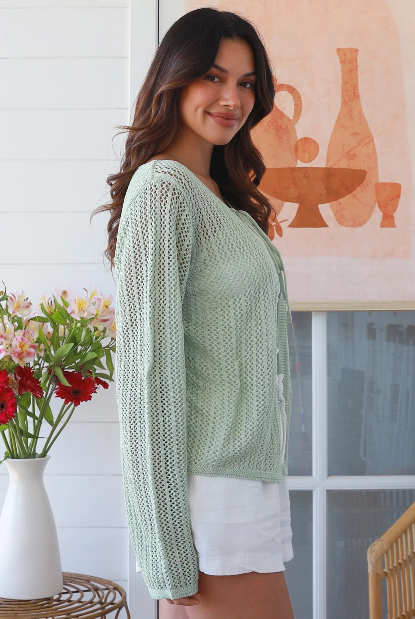 Woman wearing sage cotton crochet cardigan – textured boho statement layer by Bohemian Love Runway