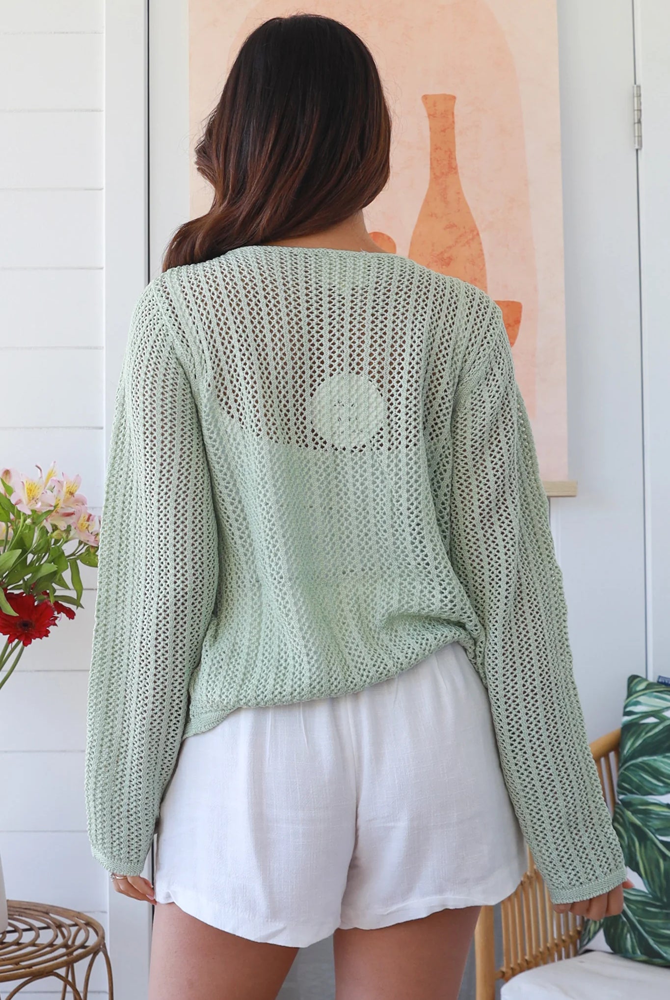 Woman wearing sage cotton crochet cardigan – textured boho statement layer by Bohemian Love Runway