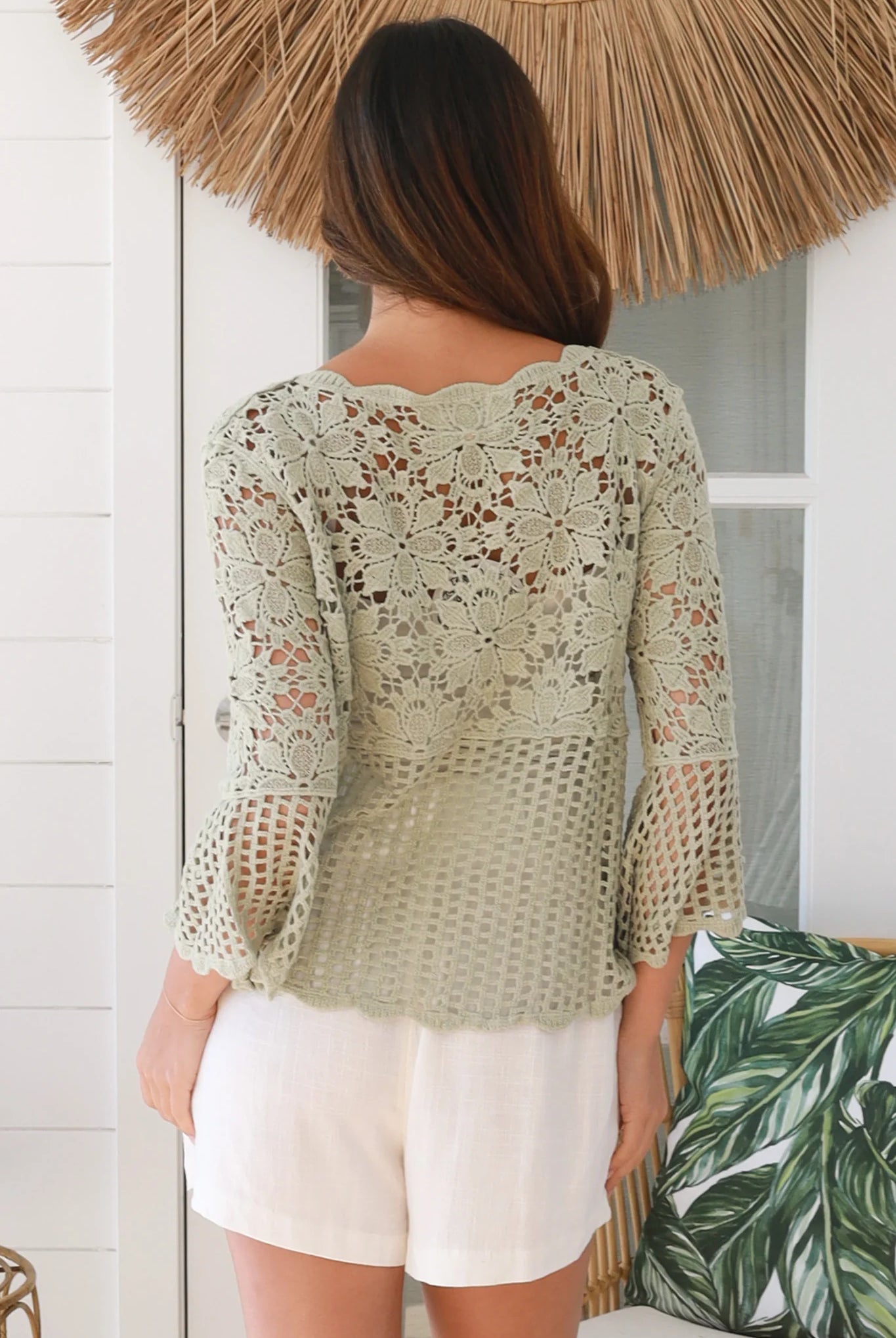 Model wearing sage green cotton crochet top with honeycomb lace and flared sleeves - Willow crochet Top Australia