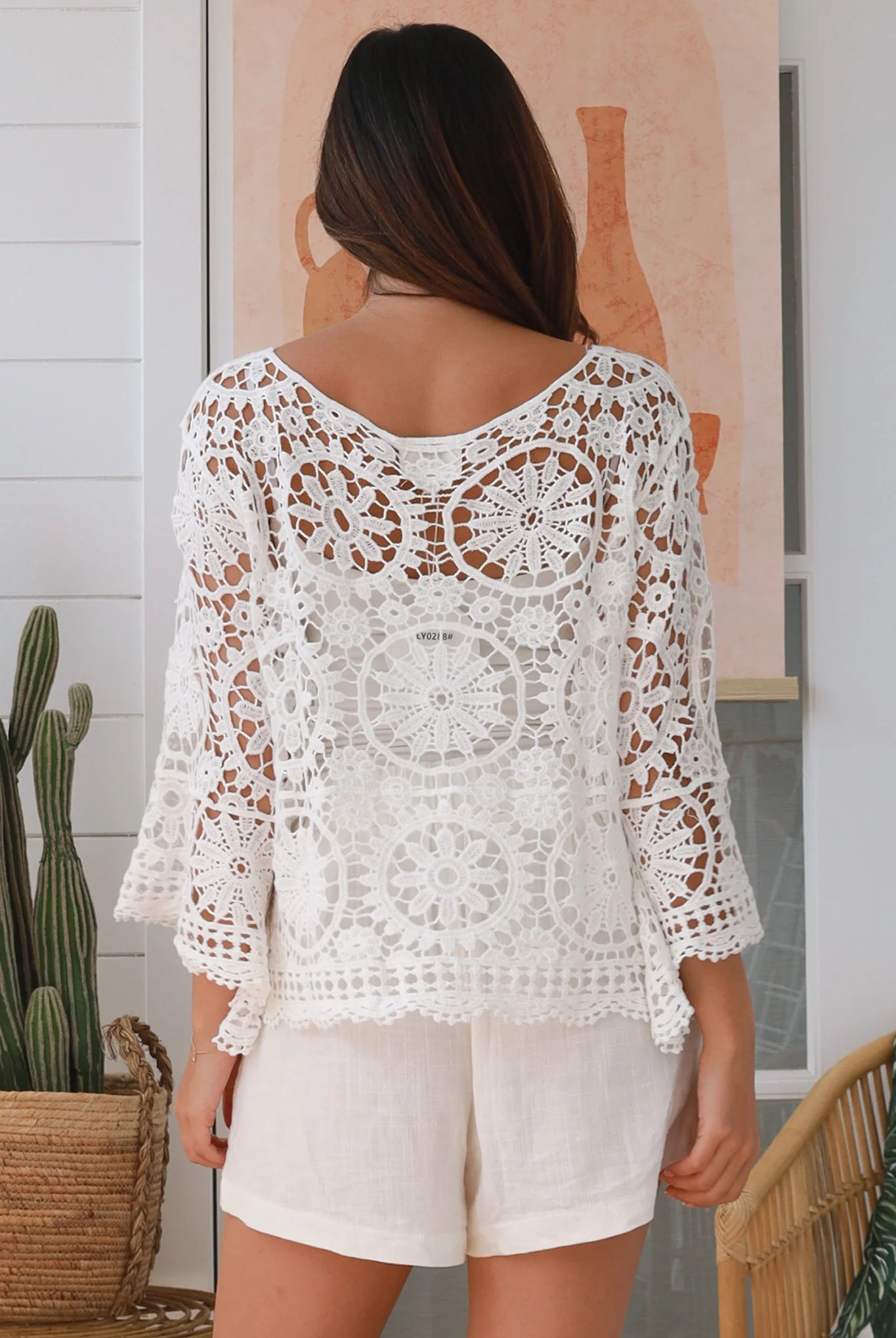 White cotton crochet boho top with bell sleeves, tassel ties and floral lace pattern - The Poet Crochet Bell Sleeve Top