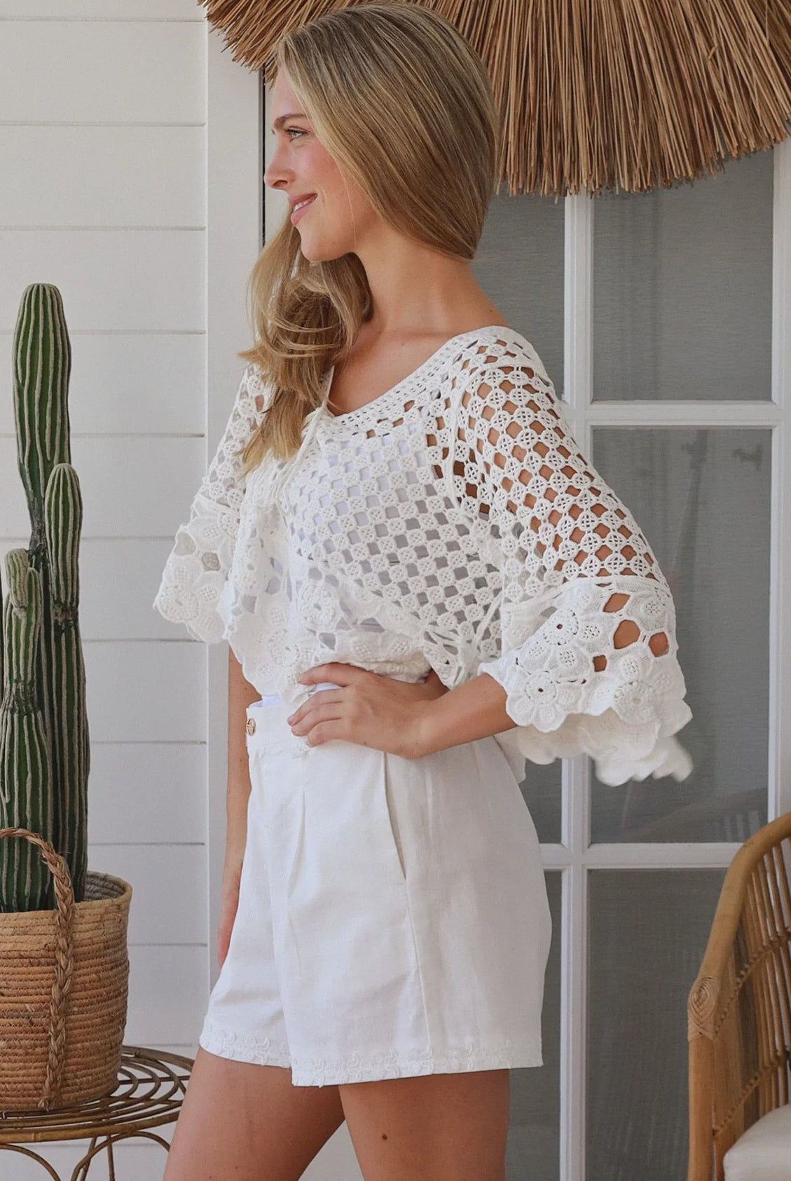 White cotton crochet boho top with tassel ties and three quarter bell sleeves lightweight textured blouse Australia