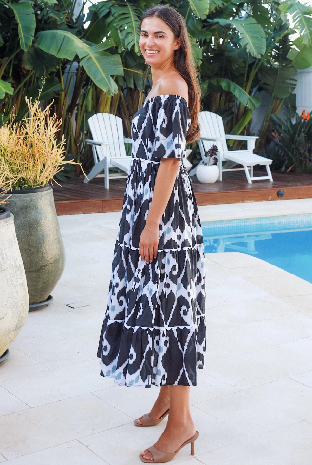 Black ikat boho midi dress worn on or off shoulder with empire waist cotton lace trim tiers and shirred back panel