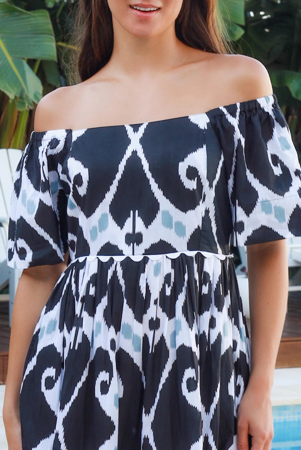 Black ikat boho midi dress worn on or off shoulder with empire waist cotton lace trim tiers and shirred back panel