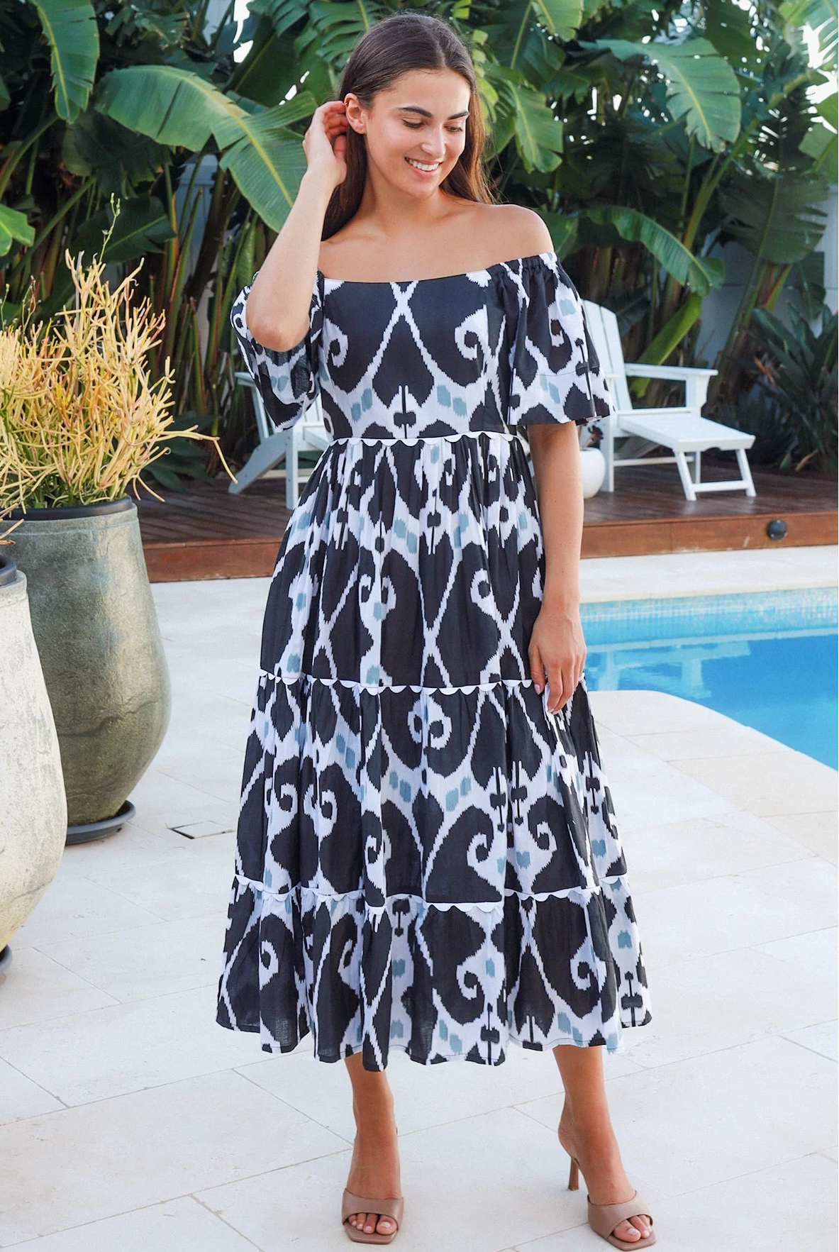 Black ikat boho midi dress worn on or off shoulder with empire waist cotton lace trim tiers and shirred back panel