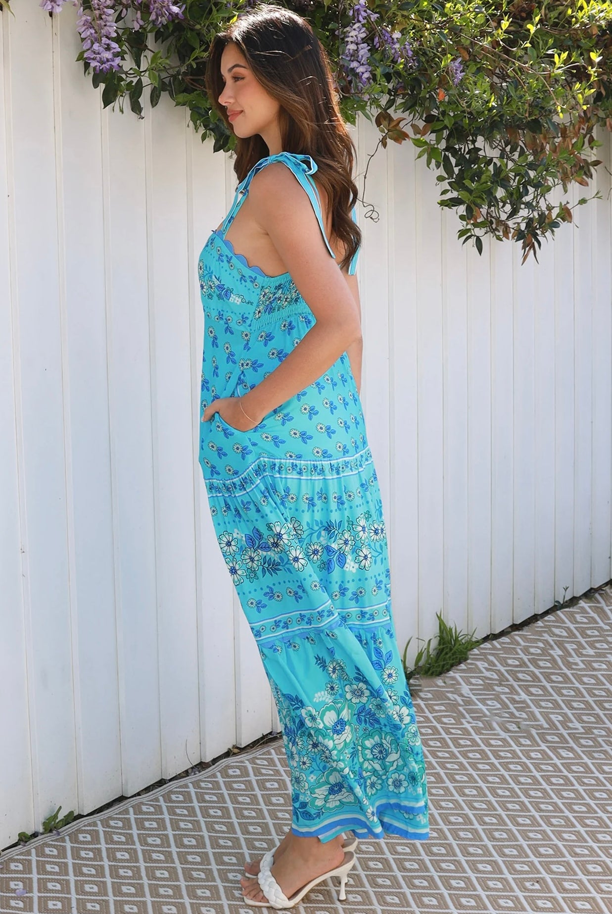 Woman wearing vintage floral boho tie-shoulder maxi dress with border print, rickrack lace and tiered hem – Dreamcatcher Isle of Bloom