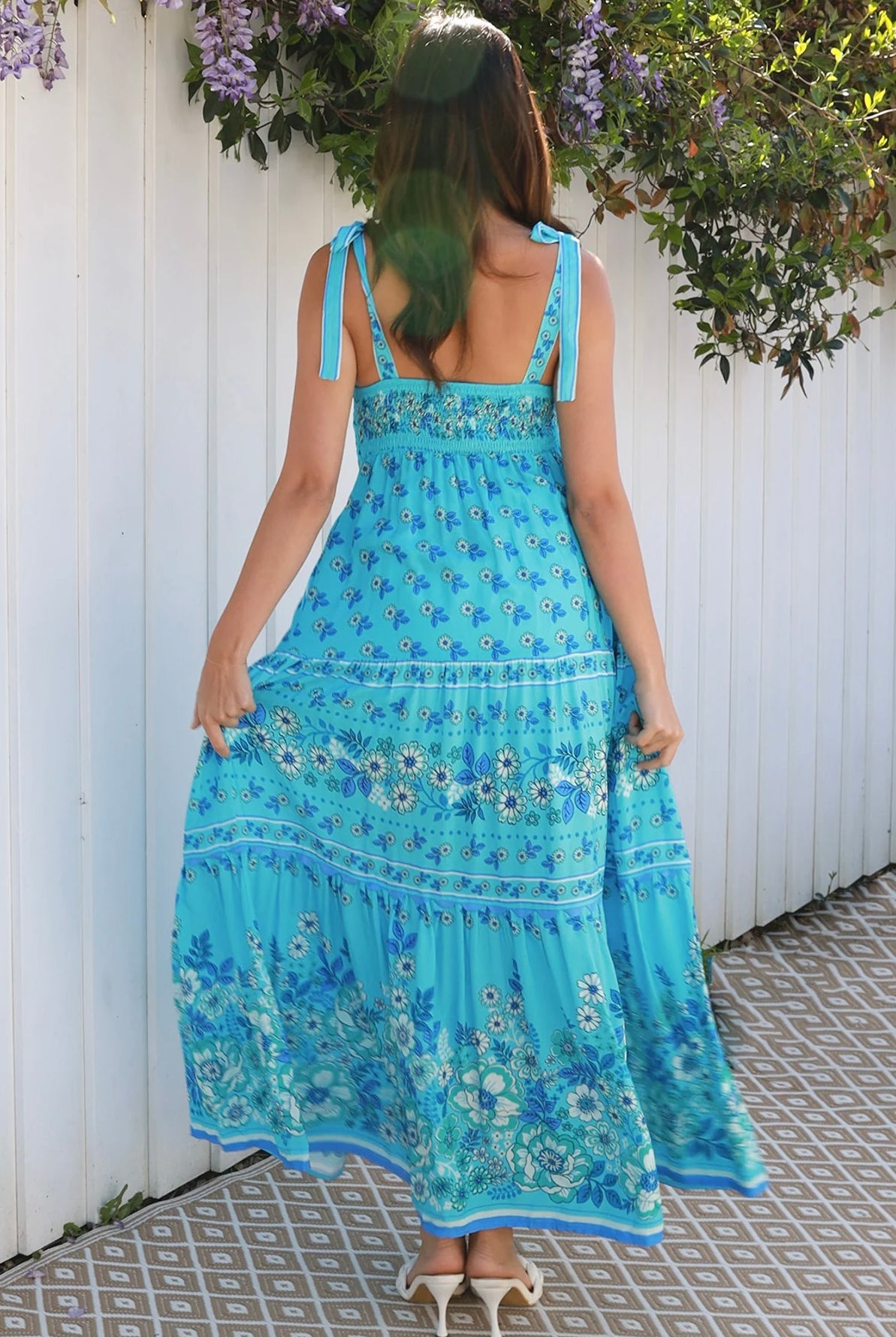 Woman wearing vintage floral boho tie-shoulder maxi dress with border print, rickrack lace and tiered hem – Dreamcatcher Isle of Bloom