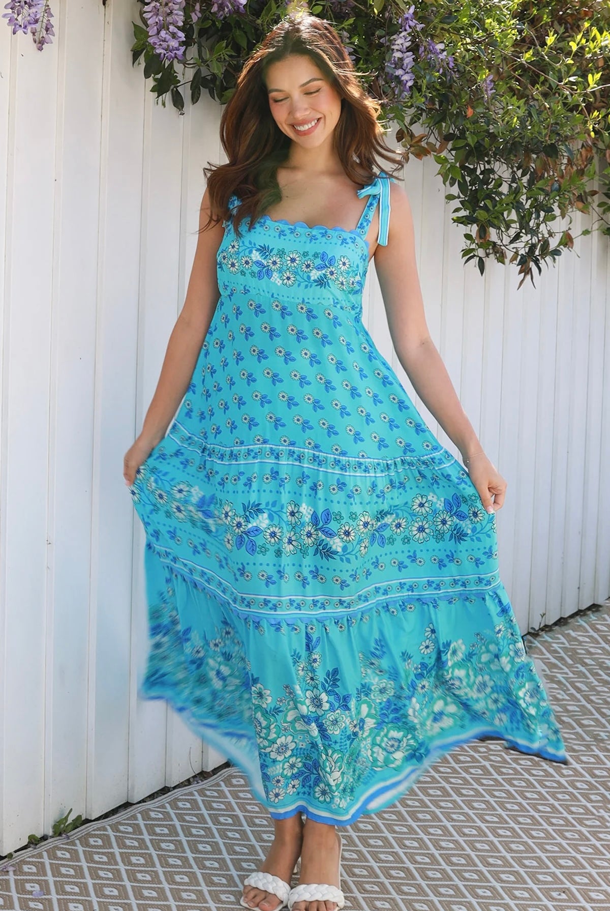 Woman wearing vintage floral boho tie-shoulder maxi dress with border print, rickrack lace and tiered hem – Dreamcatcher Isle of Bloom