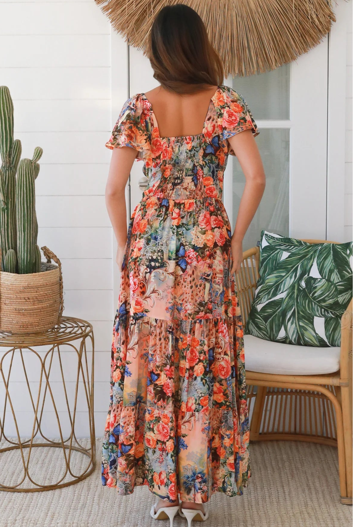 Bohemian maxi dress in butterfly floral print with elastic waist, smocked back, pockets and dramatic tiered hemline