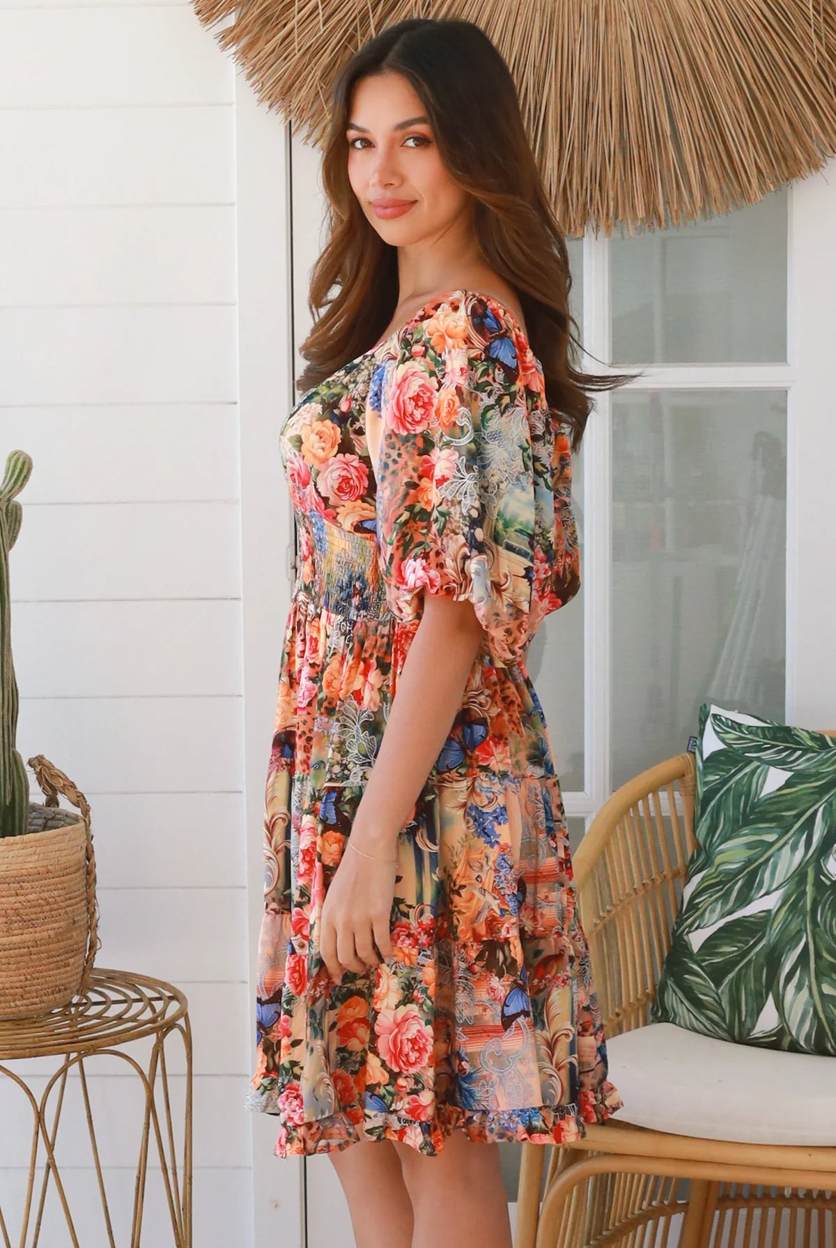 Boho mini dress in 100% rayon with floral butterfly print, shirred bodice and voluminous sleeves - designer bohemian style Australia.