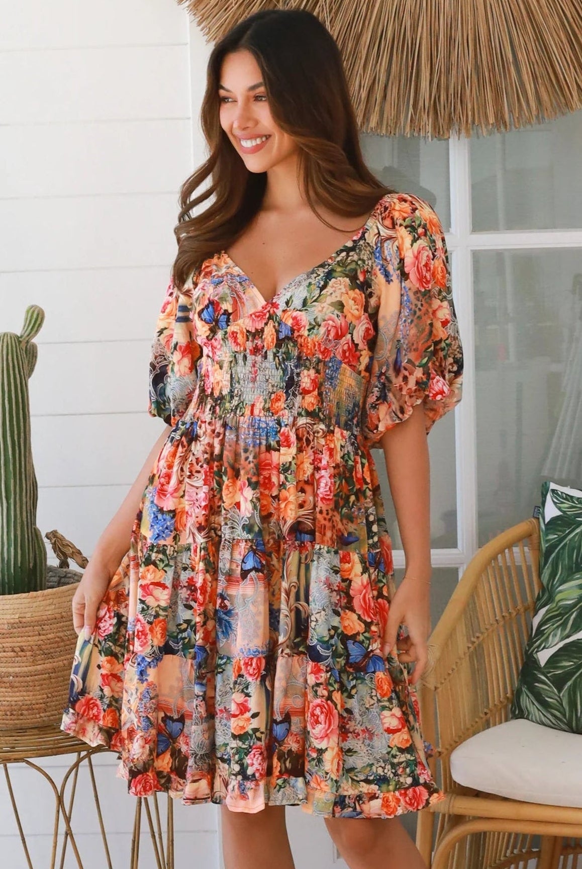 Boho mini dress in 100% rayon with floral butterfly print, shirred bodice and voluminous sleeves - designer bohemian style Australia.