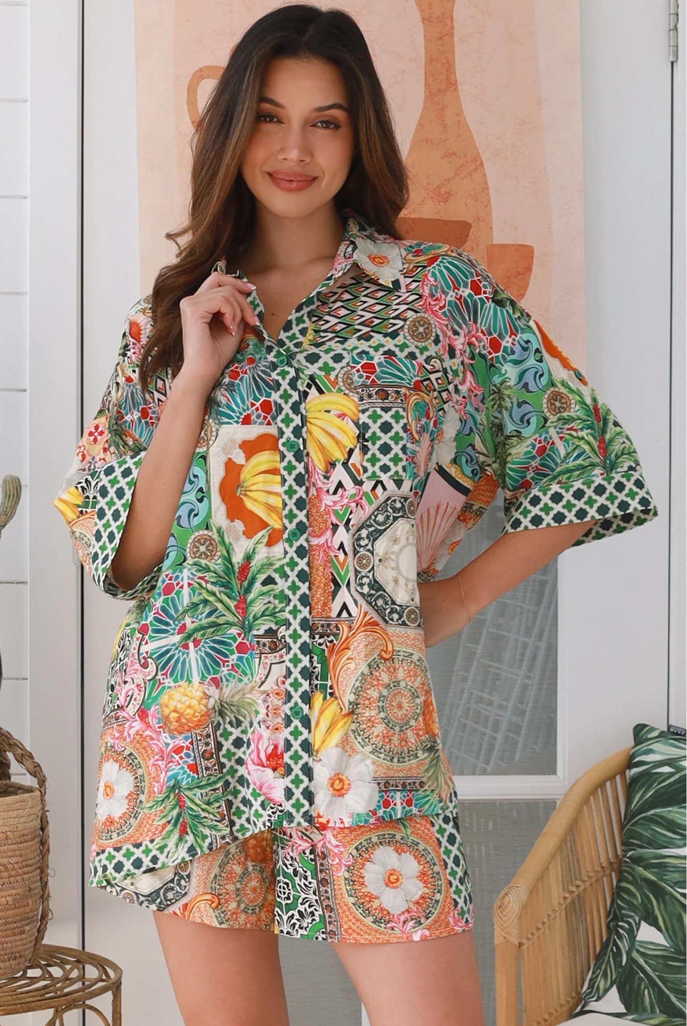 “Woman wearing tropical boho rayon shirt with border sleeves and pleated back – Amira Island Dream Shirt by Dreamcatcher, Bohemian Love Runway”