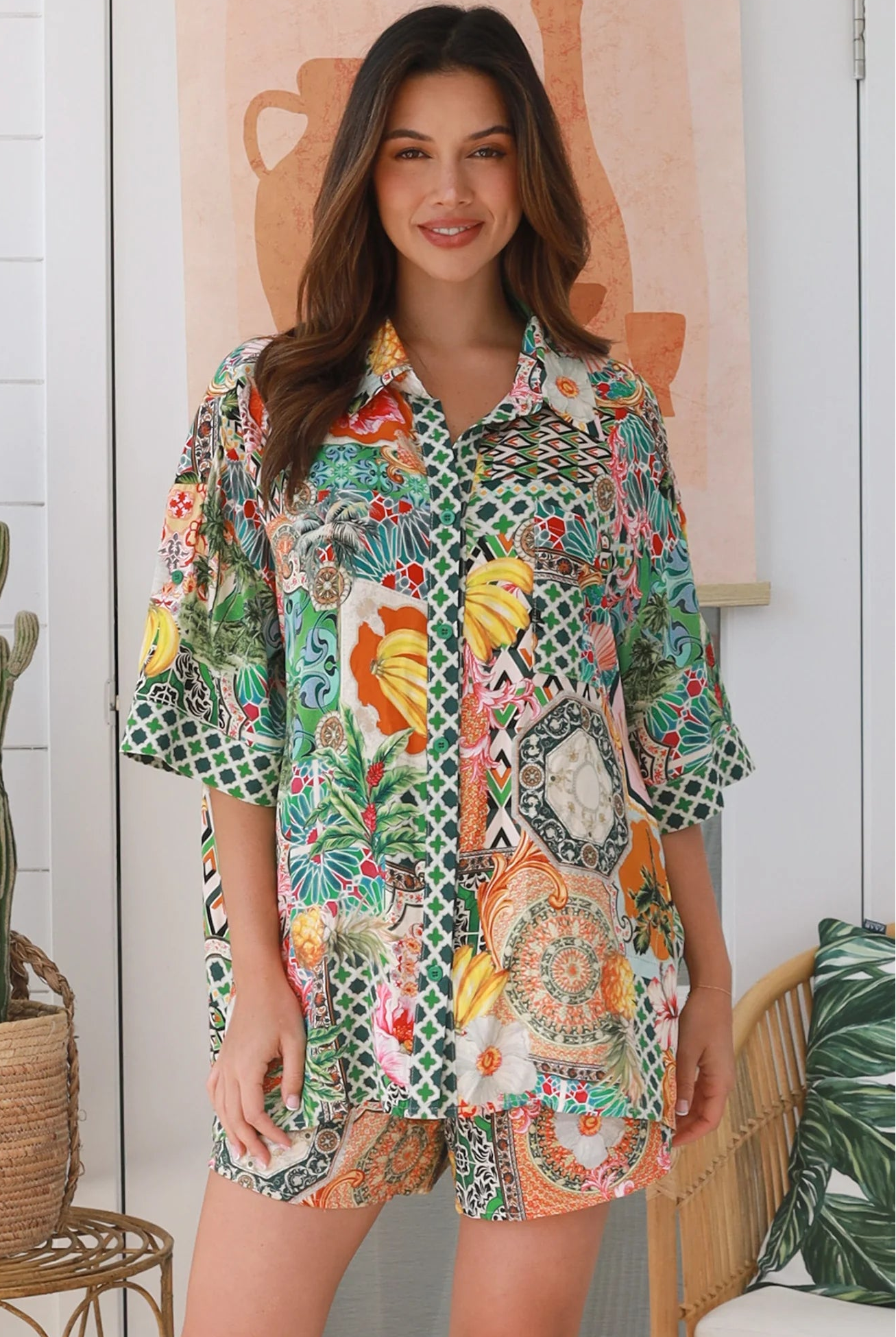 “Woman wearing tropical boho rayon shirt with border sleeves and pleated back – Amira Island Dream Shirt by Dreamcatcher, Bohemian Love Runway”