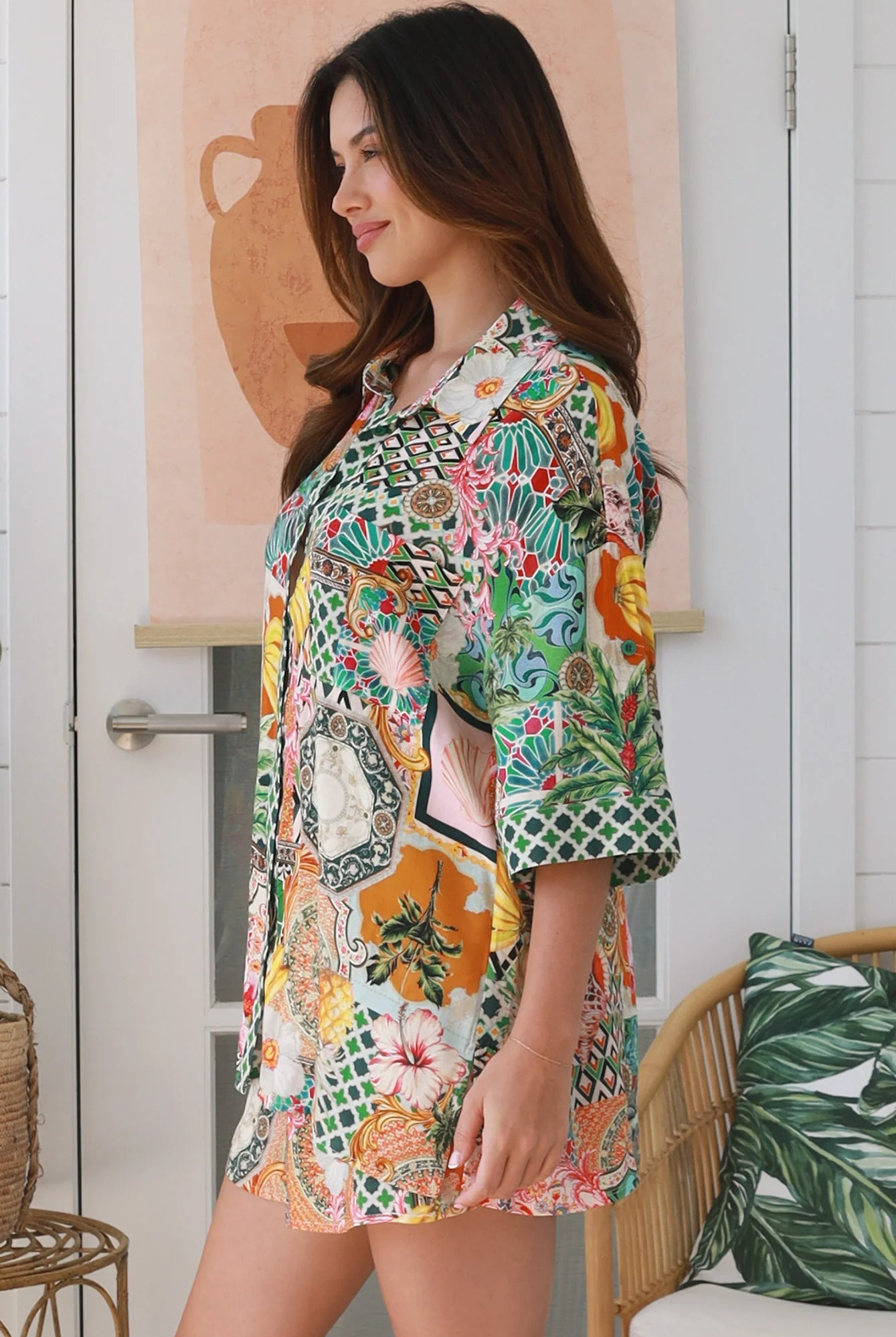 “Woman wearing tropical boho rayon shirt with border sleeves and pleated back – Amira Island Dream Shirt by Dreamcatcher, Bohemian Love Runway”
