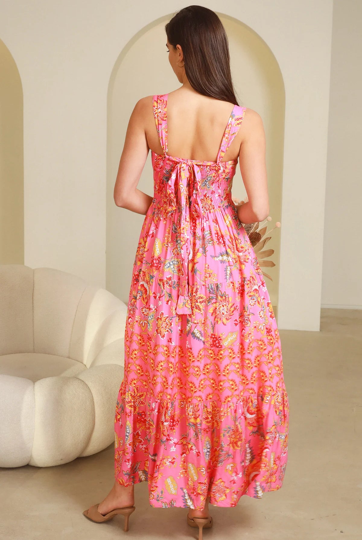 Imogen tiered floral maxi dress in pink bohemian print with fitted bodice, tie back straps and oversized tiered skirt Australia