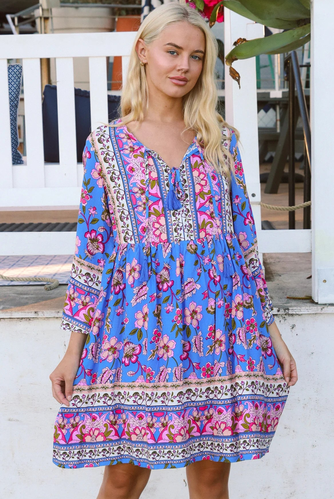 Bluebell riviera mini dress in seaside blue with picturesque florals tassel neckline and bell sleeves - boho mini dress Australia