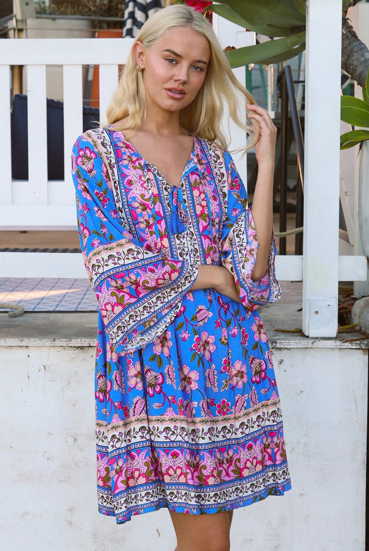 Bluebell riviera mini dress in seaside blue with picturesque florals tassel neckline and bell sleeves - boho mini dress Australia
