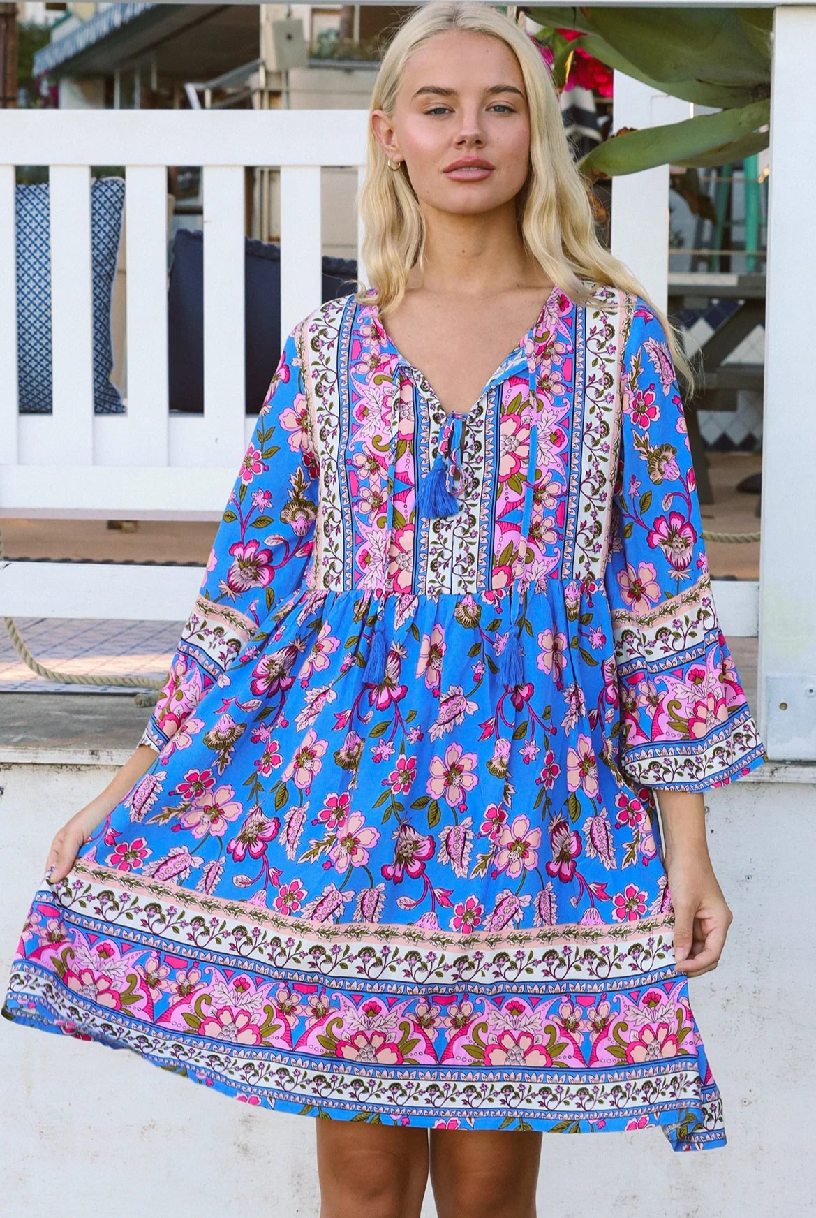 Bluebell riviera mini dress in seaside blue with picturesque florals tassel neckline and bell sleeves - boho mini dress Australia