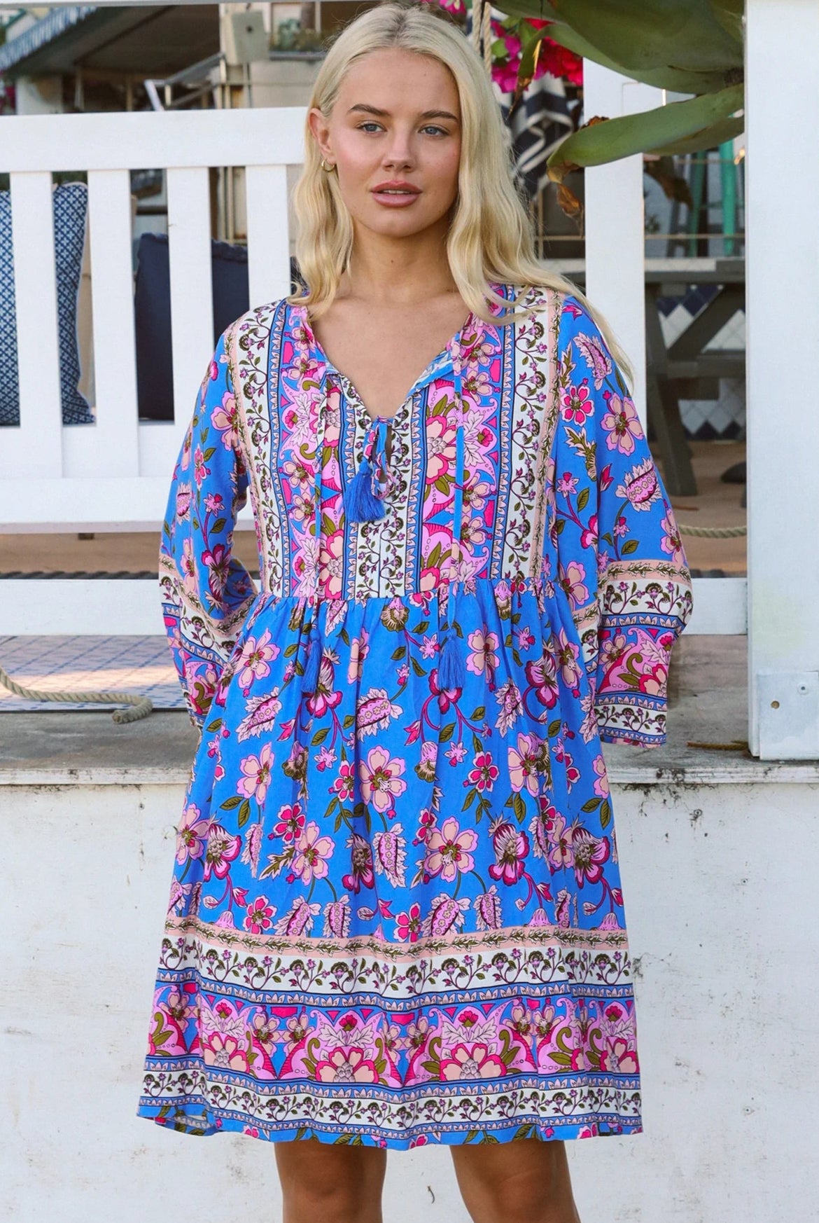 Bluebell riviera mini dress in seaside blue with picturesque florals tassel neckline and bell sleeves - boho mini dress Australia