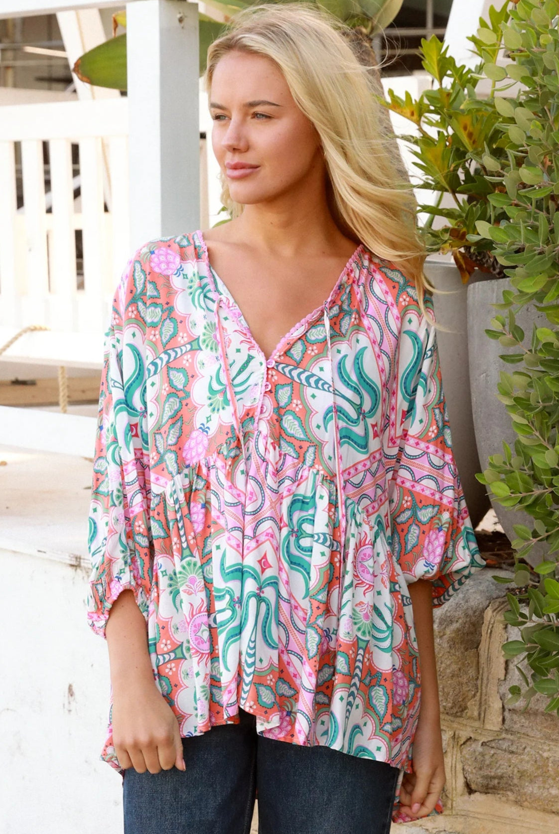 Model wearing Fiorella Boho Top in pink aqua coral teal print with voluminous sleeves - boho blouse Australia
