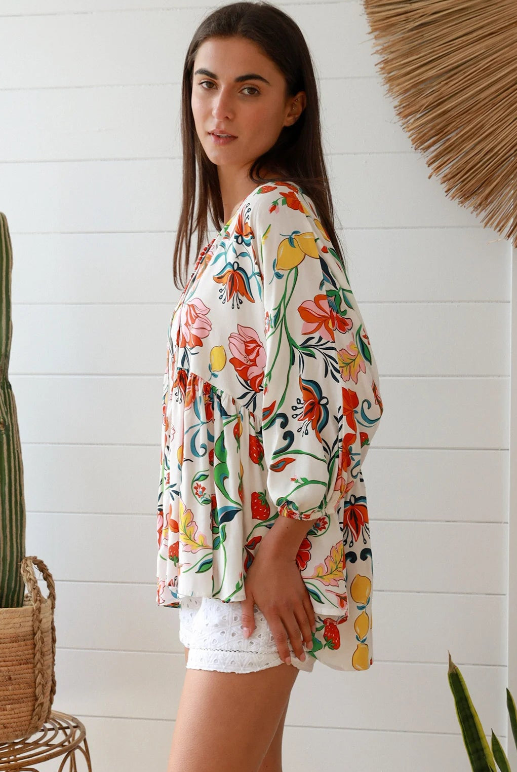 Boho floral print top with red and pink blossoms, relaxed fit, V-neckline with three-quarter sleeves - Australian bohemian fashion