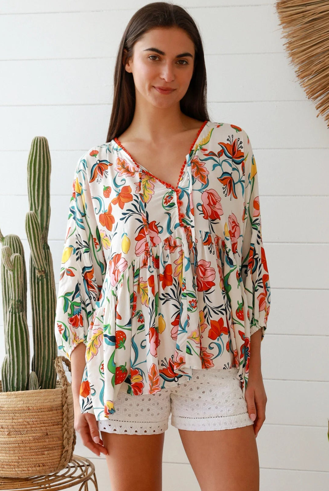 Boho floral print top with red and pink blossoms, relaxed fit, V-neckline with three-quarter sleeves - Australian bohemian fashion