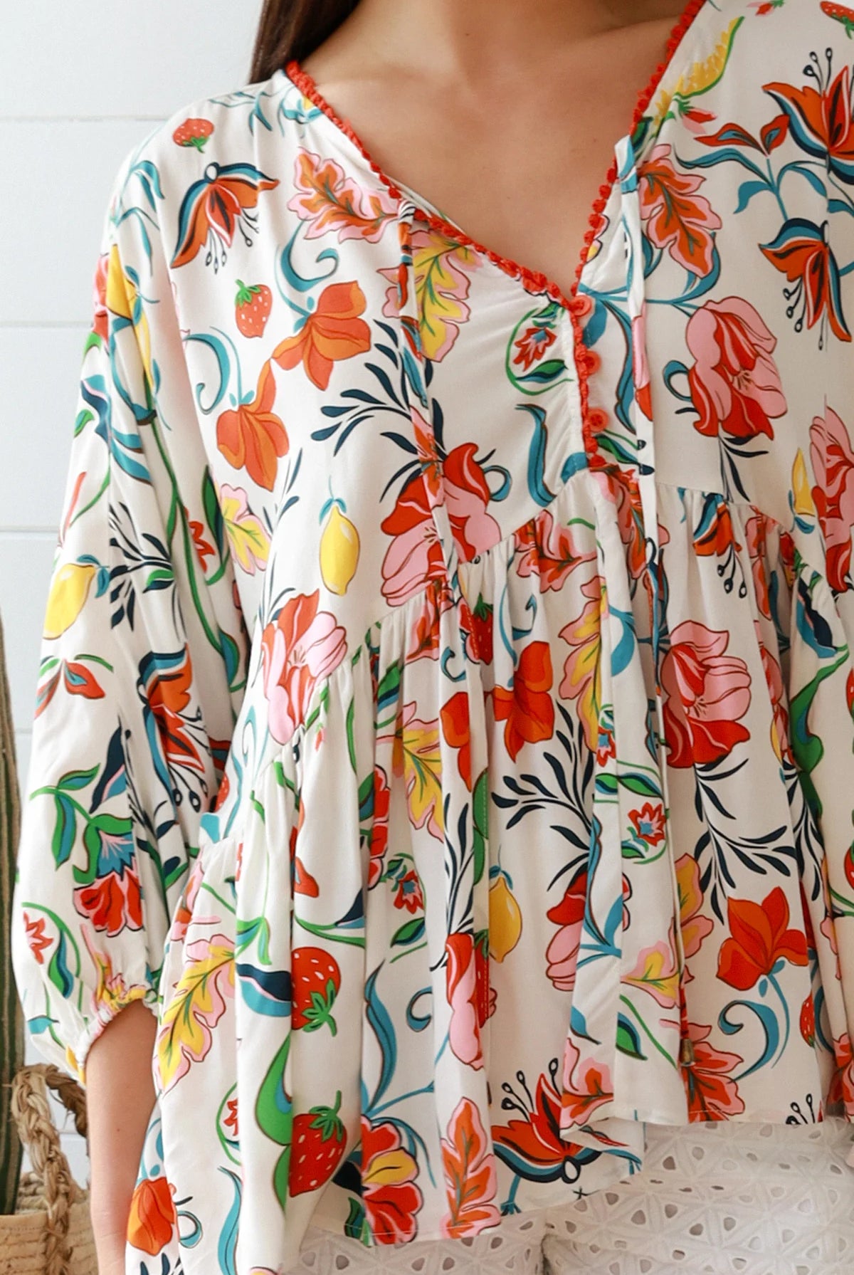 Boho floral print top with red and pink blossoms, relaxed fit, V-neckline with three-quarter sleeves - Australian bohemian fashion