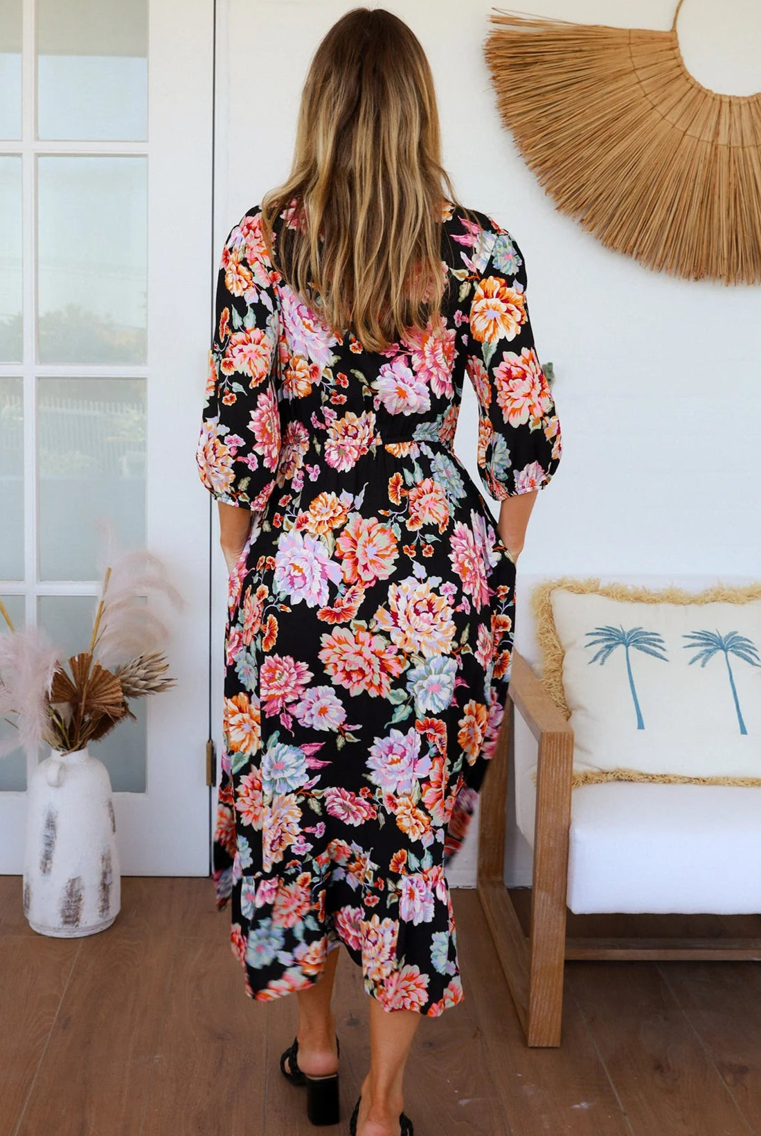 Black floral boho midi dress with painterly blooms, button front, frill hem, drawstring waist, half sleeves and pockets.