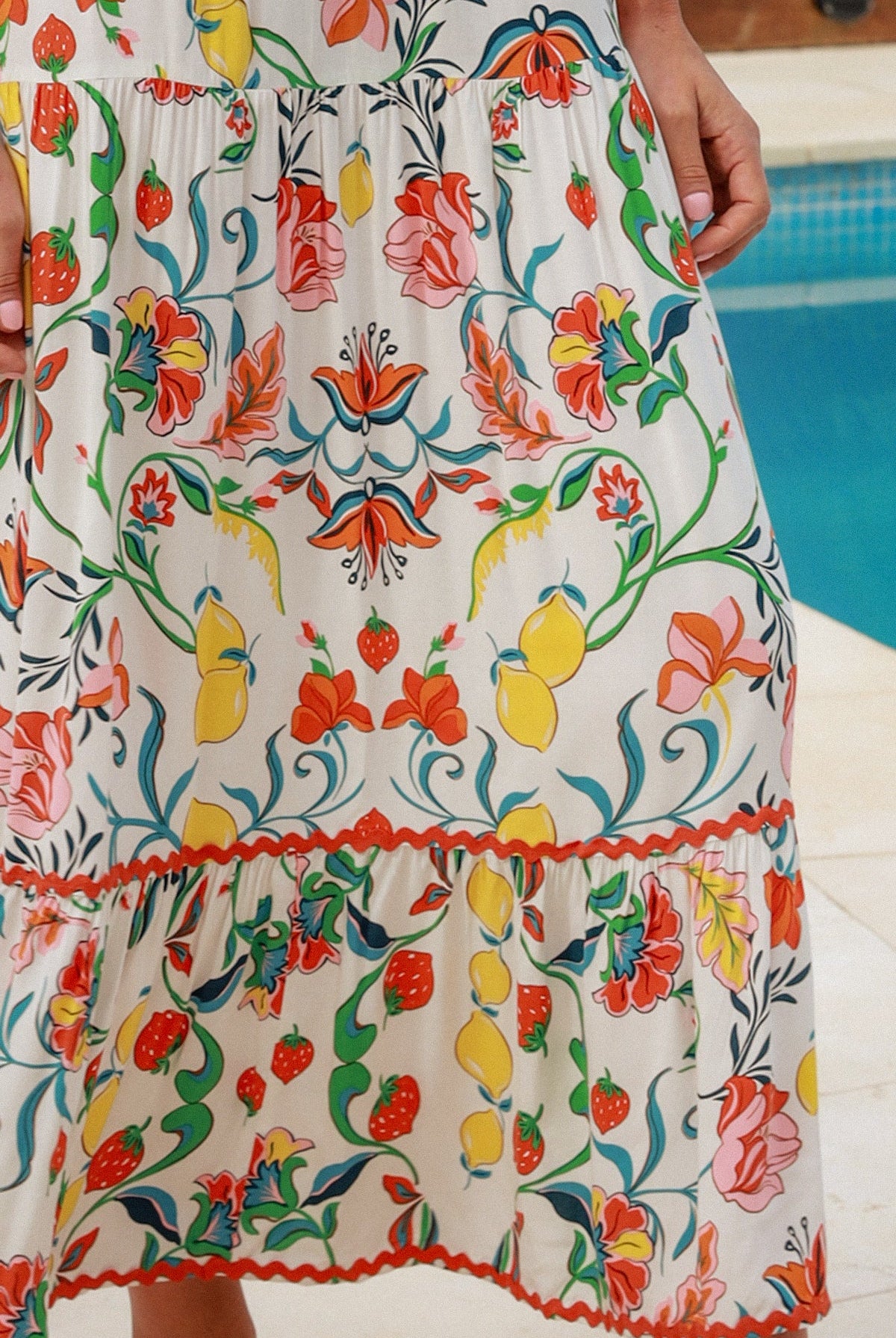 Women in Chiara Floral maxi Dress with strawberry and lemon print, zig-zag lace trim, boho frill hem - bohemian fashion Australia.