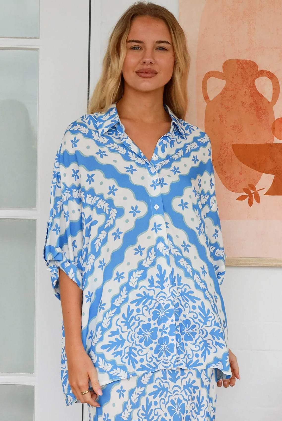 Dreamcatcher Emmy oversized blue floral rayon shirt with button front back yoke pleats and roll-tab sleeve detail