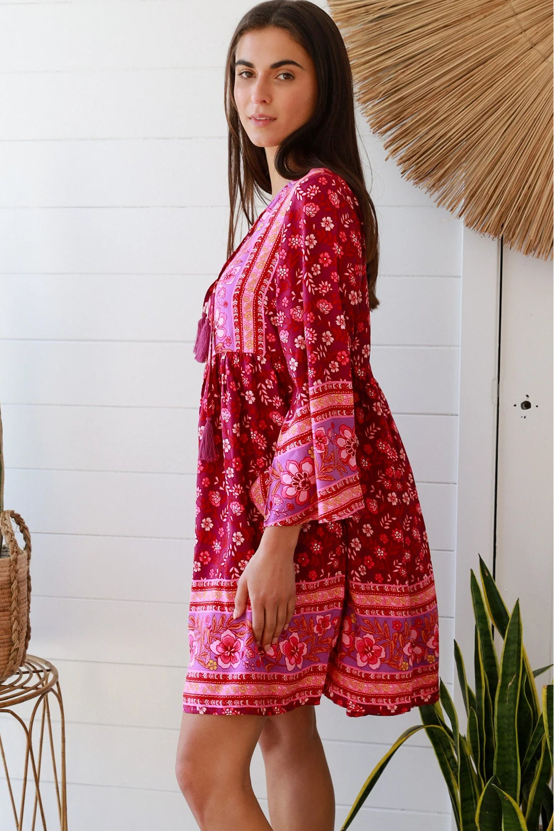 Raspberry floral bohemian mini dress with border print and flared sleeves Australian boho fashion